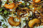 biryani with rice, cashew nuts, fried onions and herbs