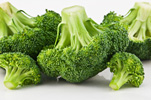 five raw broccoli florets