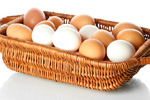 brown and white eggs in a basket