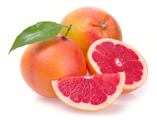 two whole pink grapefruit, one half, one segment, one leaf