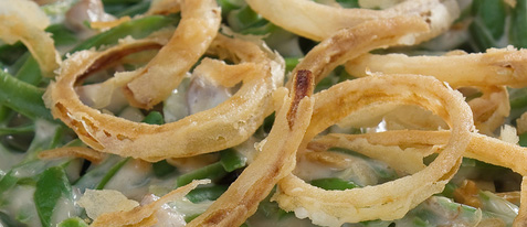 classic green bean casserole topped with crispy onion rings