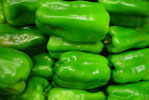 pile of shiny green bell peppers