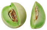 raw whole honeydew melon with a wedge cut out of it