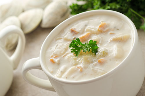 new england clam chowder in a white cup