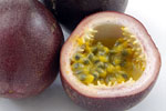 two whole unpeeled passion fruits and one half passion fruit